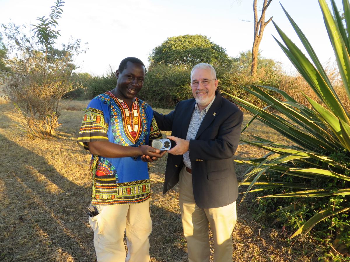 Brian Davis handing out a solar player