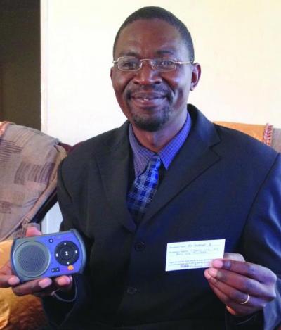 A preacher displaying his registration and player